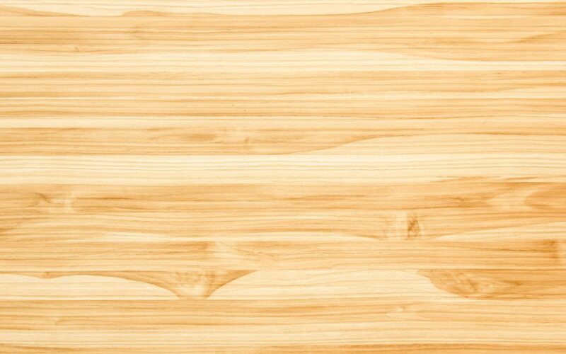 Bright and clean wooden texture with visible grain patterns, ideal for backgrounds or copy space.