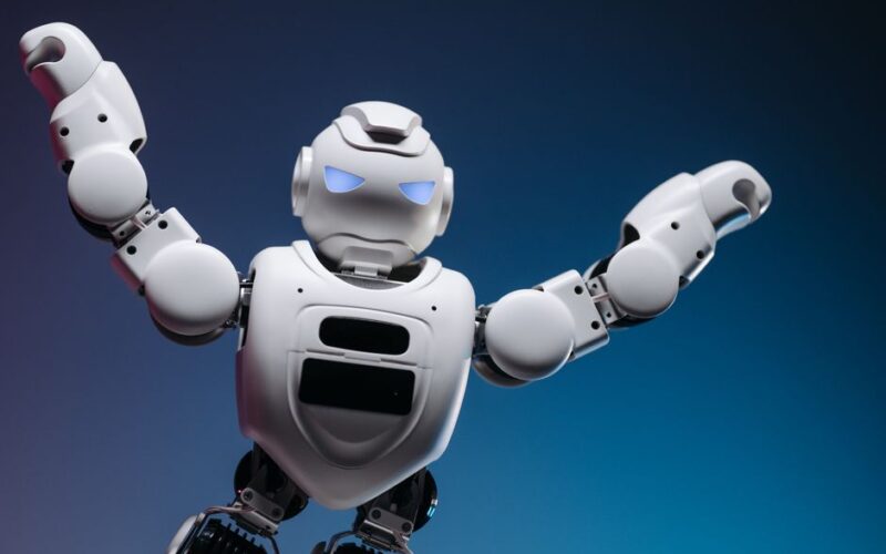 A futuristic robot in a studio setting, striking a powerful pose with raised arms.
