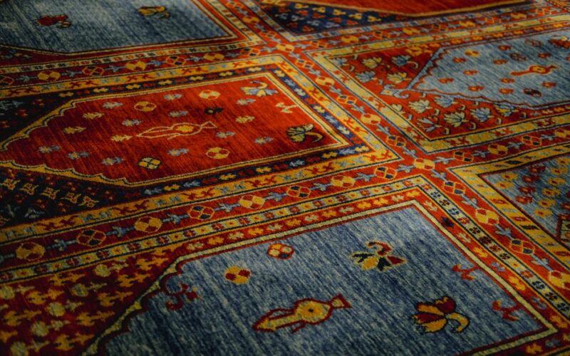 Vibrant handmade Turkish carpet with intricate patterns and rich colors. Perfect for interior decor.