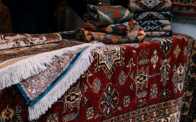 A selection of intricately designed Persian rugs with vibrant patterns and colors, showcasing classic elegance.