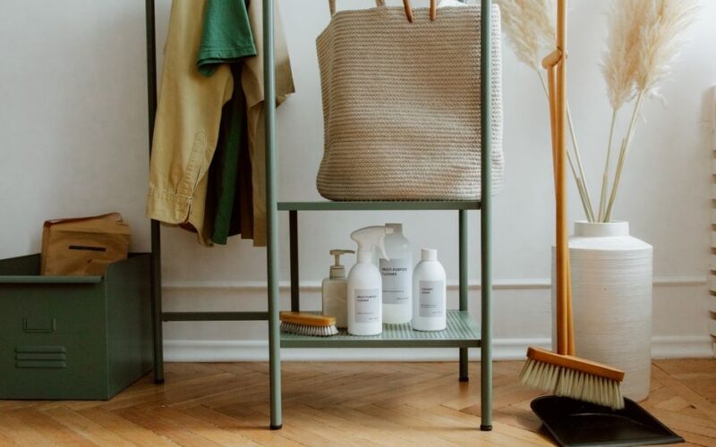 Eco-friendly cleaning products and home storage solutions in a modern, minimalist interior.